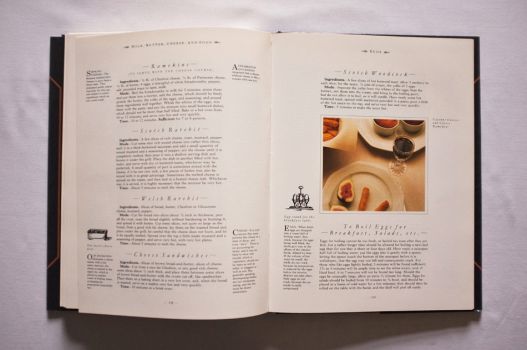 On these two pages from Chapter 12 of The Shorter Mrs. Beeton, on Milk, Butter, Cheese and Eggs, are six recipes for basics such as Welsh Rarebit, Cheese Sandwiches and even To Boil Eggs, along with a colour photograph of Cayenne Cheeses and Cheese Ramekins. 
