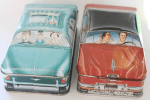 Colour photograph of two tin boxes designed by Ian Logan in the form of American cars. 