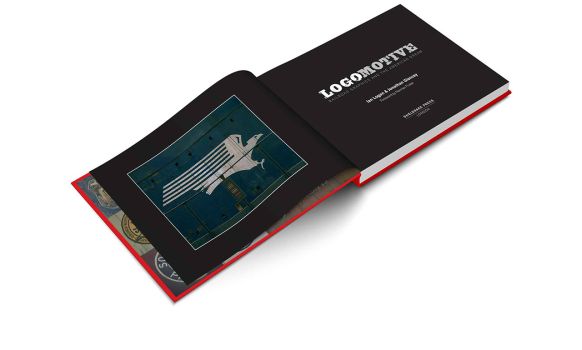 In this colour photograph of Ian Logan’s book Logomotive open at the title page, his photograph of a Missouri Pacific eagle logo is the frontispiece, painted in white on the side of a diesel locomotive. The pages have a black background with the title and byline dropped out in white.