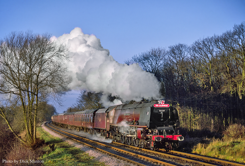 In this colour photograph by ©Dick Manton the 4-6-2 Coronation class locomotive Duchess of Hamilton hauls a special passenger train at Pontefract, West Yorkshire, smoke pouring from its chimney.