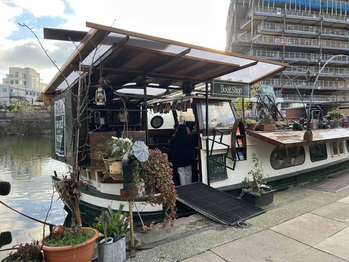 A Dutch barge on Regent’s canal has been converted into a bookshop and adorned with pot plants.
