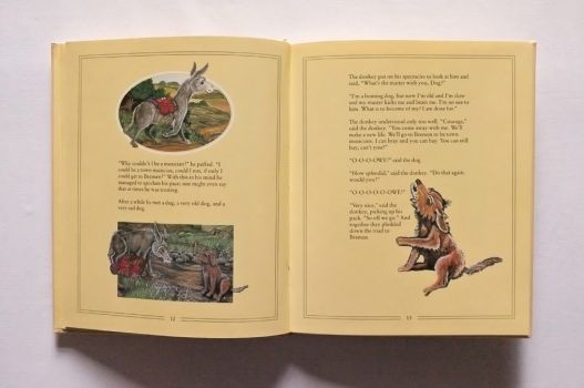 Illustrations of the dog and donkey meeting in the Musicians of Bremen.