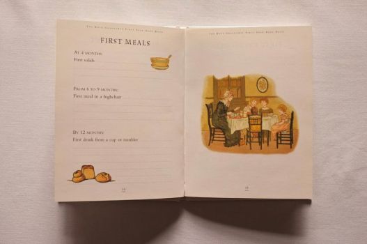 Pages 16 and 17 of The Kate Greenaway First Year Baby Book have spaces to track the child’s first solids at 4 months, first meal in a highchair from 6 to 9 months and first drink from a cup or tumbler by 12 months, with colour illustrations of loaves of bread, a bowl of porridge and a mother eating with her children. 