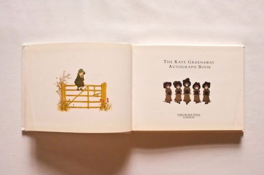 On the title page of The Kate Greenaway Autograph Book, a little girl perches on a wooden gate while five sisters walk in a row.