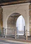 An archway at London Bridge station is embellished with a classical portico.