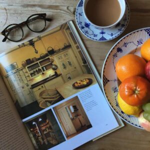In a picture essay on Kitchens, four colour photographs provide ideas for enhancing otherwise basic rooms with good lighting and decorative touches, such as hand-painted motifs on the doors.