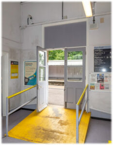 The platform doors at Eynsford have their fanlight boarded up and are painted an institutional grey.