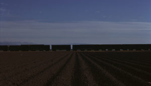 In this early-morning colour photograph taken on Kodachrome by Ian Logan in the 1970s a freight train crosses the asparagus fields of Salinas Valley, south of San Francisco.