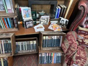 A selection of classic books is displayed in old wine crates.