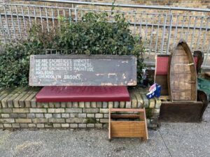 A cushions and shelving units extend the bookshop onto the towpath.