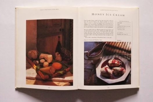 A double-paged spread showing an image of cheese and a wine tray on the left and a honey ice cream recipe on the right. 