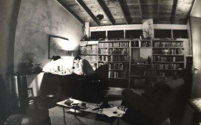 Black and white photo of Douglas Botting at his desk in the 1950s.