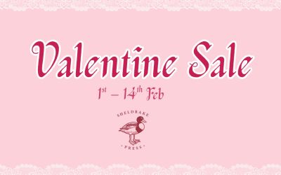 In this graphic, the title Valentine Sale is centred, with the dates 1st to 14th February specified below. The background is pastel pink with a border of white lace, and a red version of the Sheldrake logo is featured underneath the text.