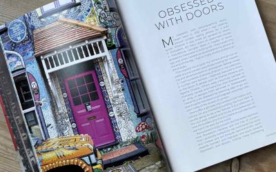A double-page spread from ‘Doors of London’ features a full-page image of a colourful door and a column of text entitled Obsessed with Doors.